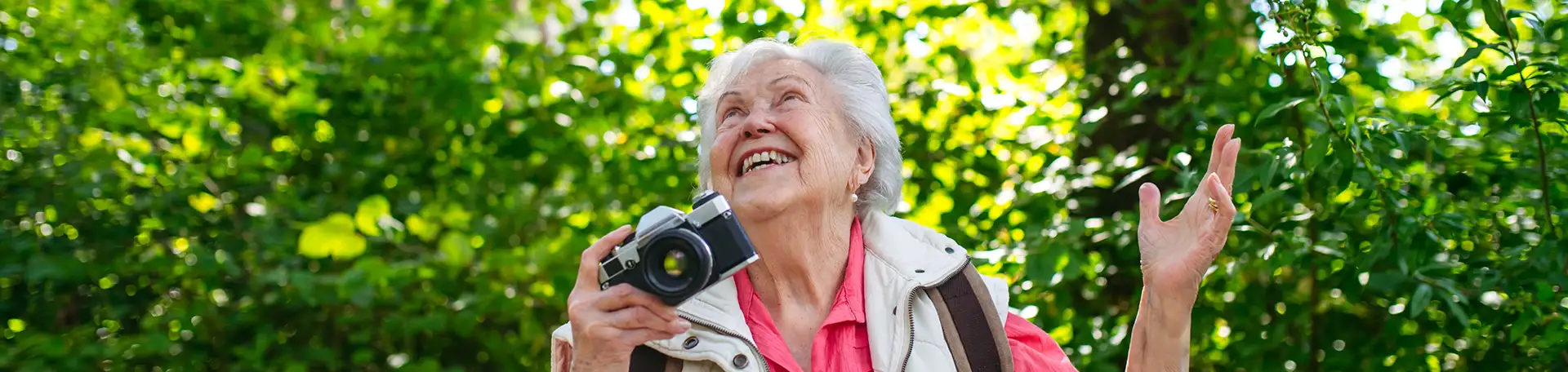 A couple with a camera outdoors