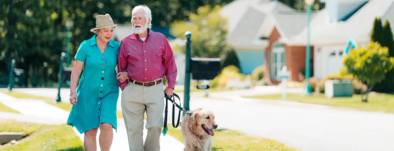 Covenant Woods residents walking their dog around the neighborhood