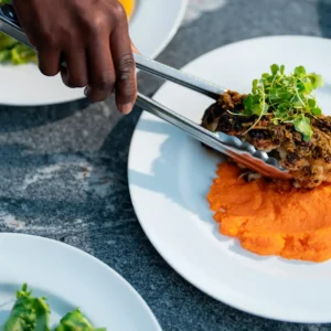 Plating a delicious dish at Covenant Woods