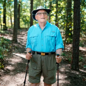 Covenant Woods resident enjoying a walk through the woods